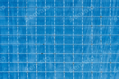 Preview: Metal mesh with square cells on blue painted background
