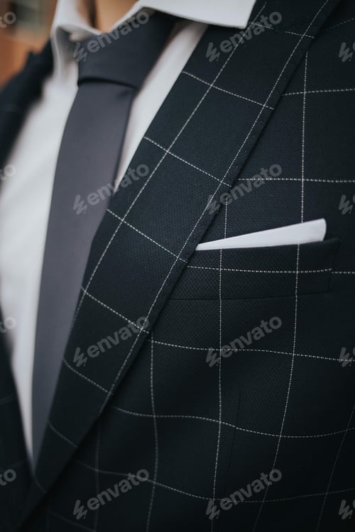 Preview: Closeup shot of a groom preparing for his wedding