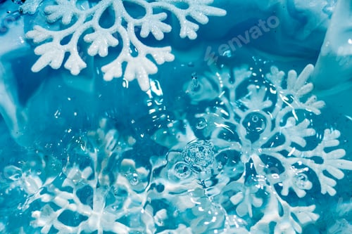Preview: snowflake melts in ice water drops macro background
