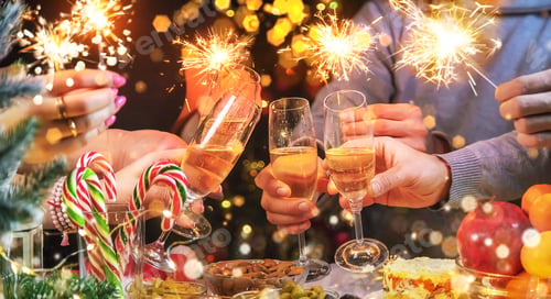 Preview: Champagne in hand against the background of the Christmas tree. People. Selective focus.