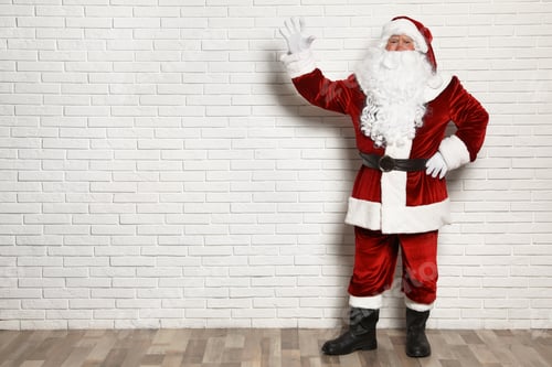 Preview: Authentic Santa Claus against white brick wall. Space for text