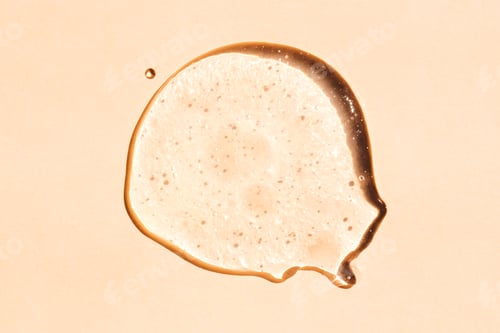 Preview: Squeezed cosmetic clear cream gel texture. Close up photo of transparent drop of skin care product