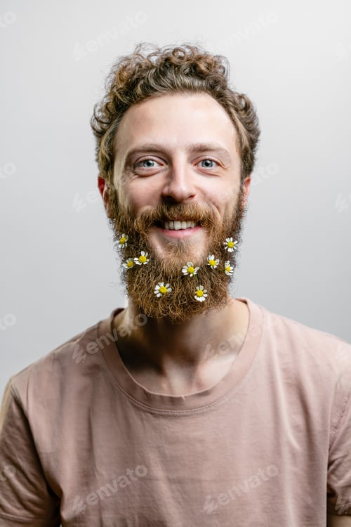 Preview: Satisfied cheerful handsome man smiles at camera isolated over white background.