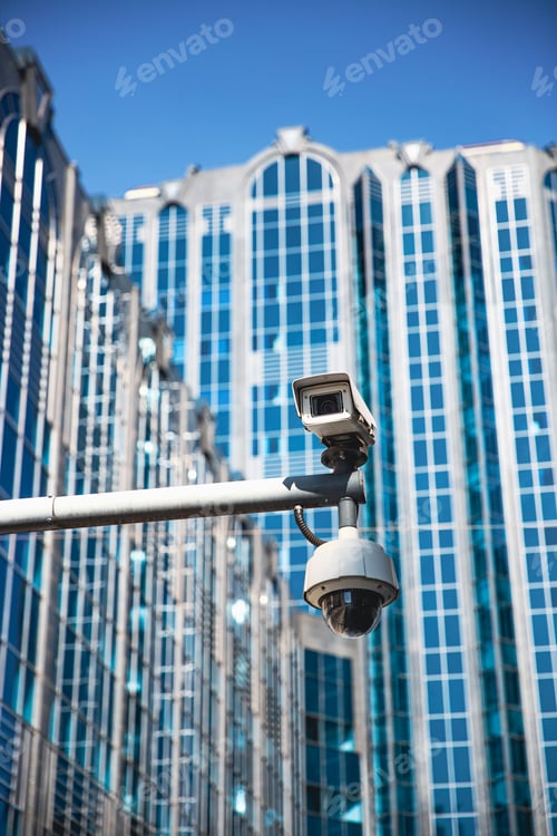 Preview: A CCTV surveillance camera in a modern city environment and office buildings