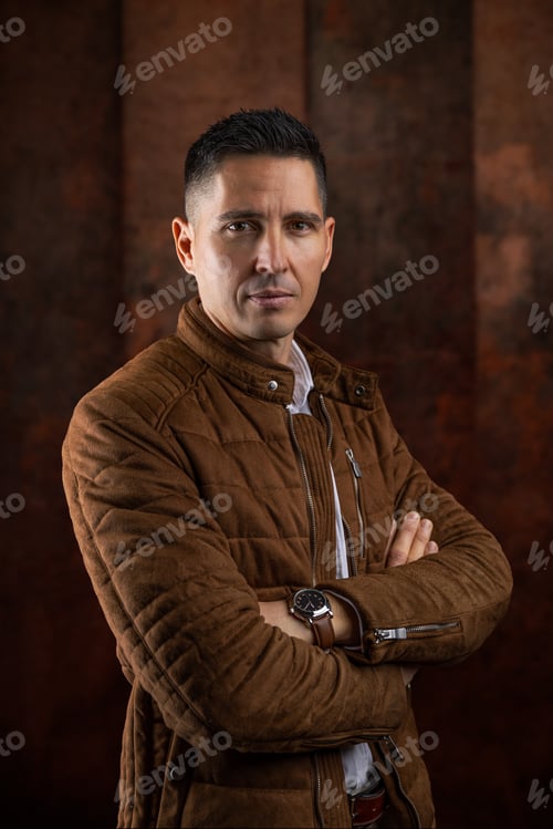 Preview: Serious man with folded arms posing