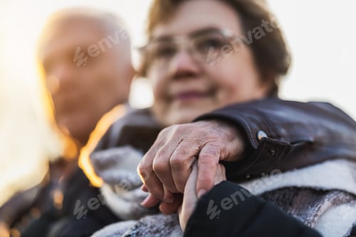 Preview: Older Woman Holding the Hand of Older Man