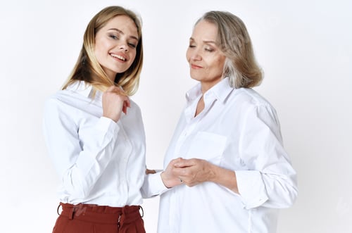 Preview: cheerful mom and daughter in white shirts embrace lifestyle