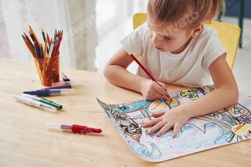 Preview: Learning new ways. Cute little girl in art school draws her first paintings by pencils and markers