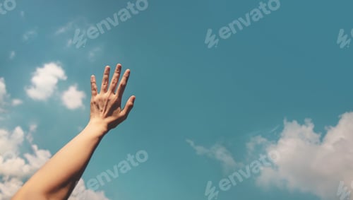 Preview: Hand reaching toward the bright blue sky, symbolizing freedom, hope, positivity