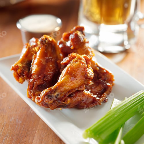 Preview: bbq buffalo wings with celery and ranch.