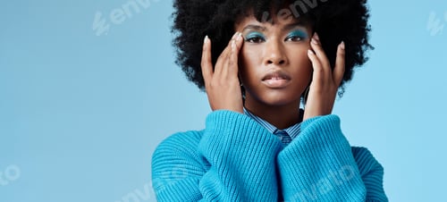 Preview: Blue makeup, fashion and beauty with a black woman in studio against a wall background for a photo