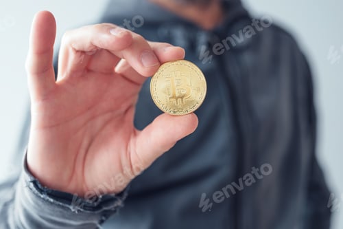 Preview: Man showing Bitcoin
