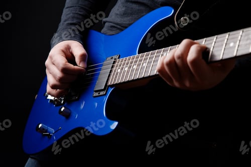 Preview: musician rock guitarist playing a blue guitar