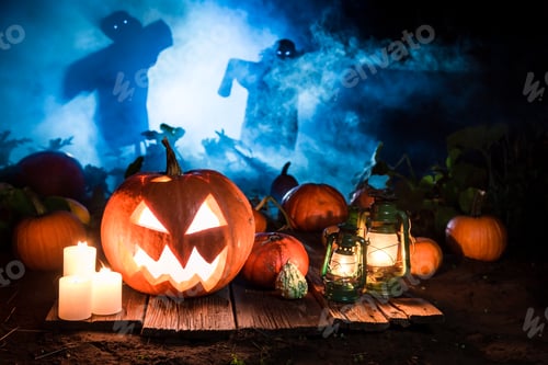 Preview: Orange pumpkin on dark field with scarecrows for Halloween