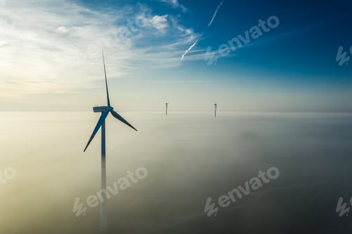 Preview: Wind turbines over mist at sunrise in Poland