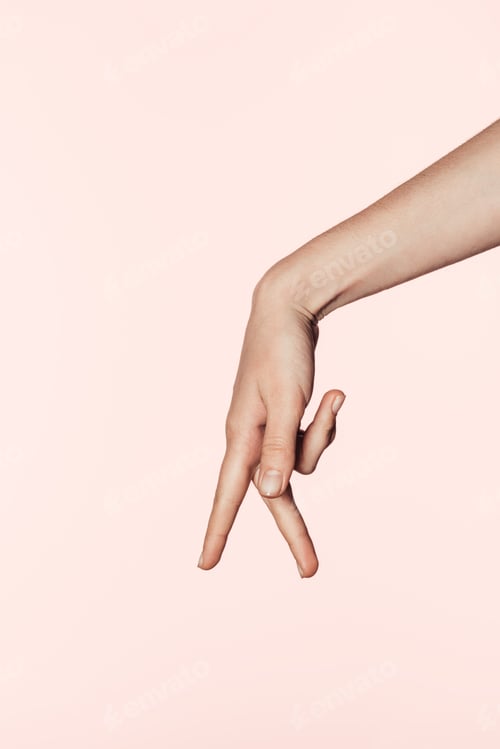 Preview: cropped image of woman showing gesture with two fingers down isolated on pink background