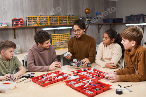 Preview: Group of Kids with Teacher in Engineering Class
