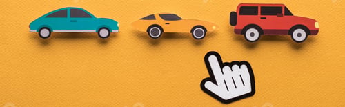 Preview: top view of paper cut cars with pointing hand on orange background, panoramic shot
