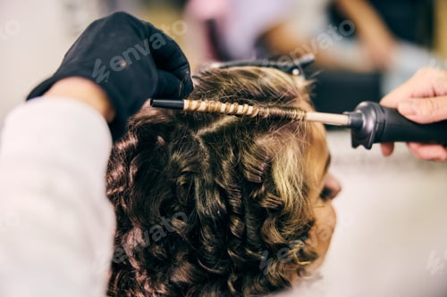 Preview: Hairdresser Styling Curls In A Modern Salon