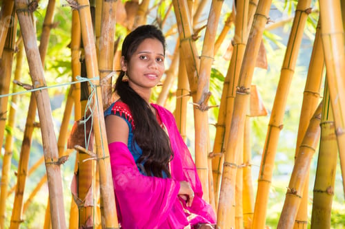 Preview: Happy smiling girl in bamboo forest.