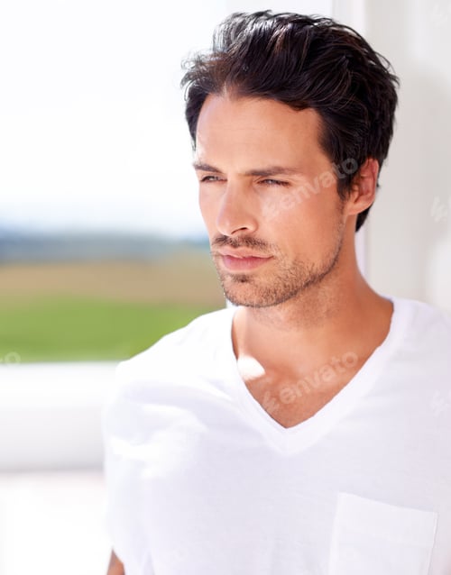 Handsome Man in White Shirt Looks Away