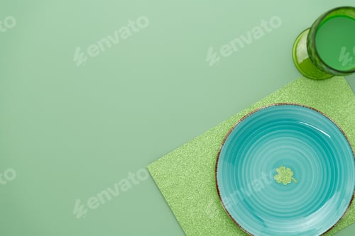 Preview: Green place setting for St Patricks dinner with a clover