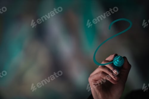 Preview: cropped view of man writing graffiti with marker