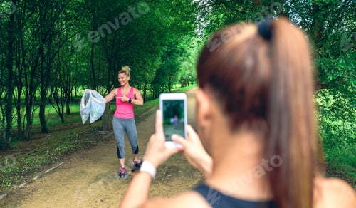 Preview: Girl taking picture of a friend after plogging