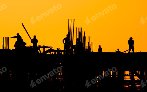 Preview: Construction workers at sunset.