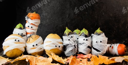 Preview: Halloween background. Creepy vegetables with eyes on a dark background. Halloween food