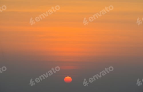 Preview: Sunset sky. Abstract nature background. Dramatic blue and orange, colorful clouds at twilight time.