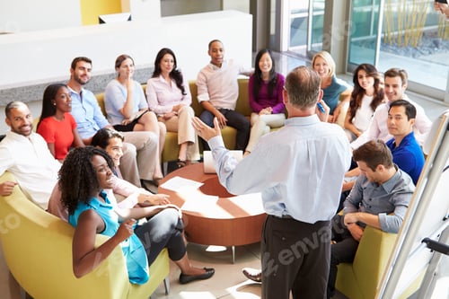 Preview: Businessman Making Presentation To Office Colleagues