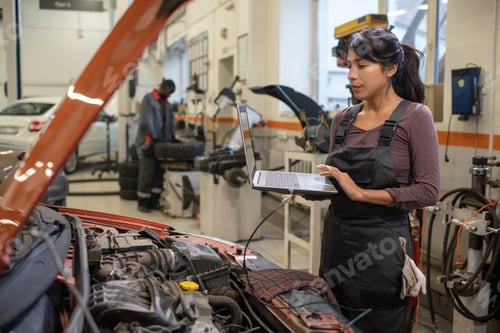 Preview: Female Mechanic Checking Engine Errors