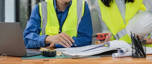 Preview: Two engineer working in office with blueprints, inspection in workplace for architectural plan