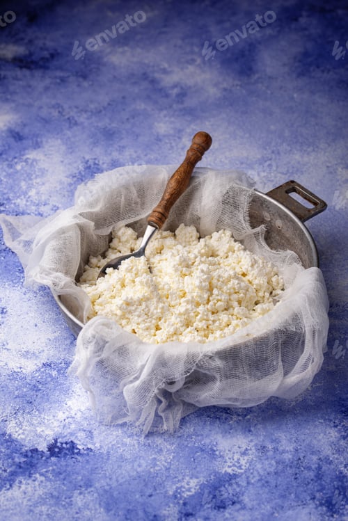 Preview: Homemade cottage cheese on blue background