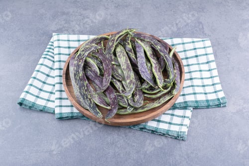 Preview: Dark green beans isolated in a platter on the background