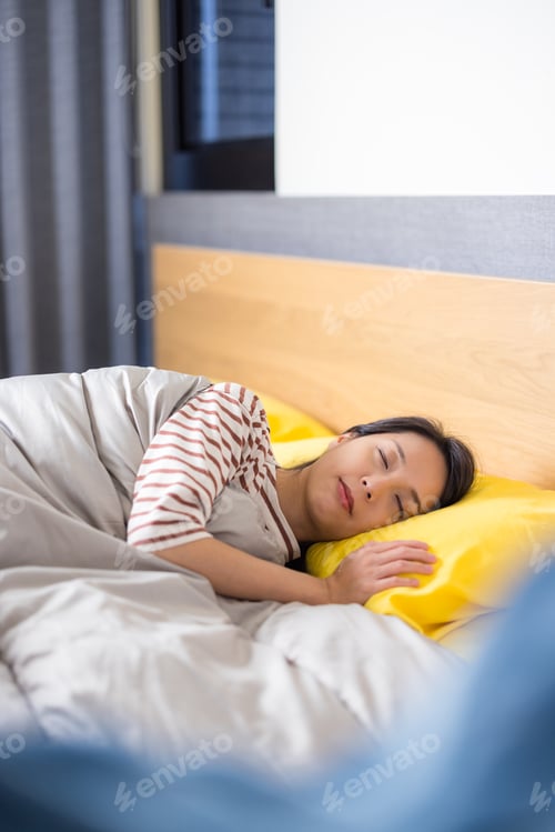 Preview: Woman peacefully sleep on comfortable bed