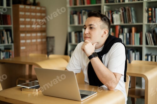 Preview: the student uses a laptop online, surfing the Internet search information training and lecture