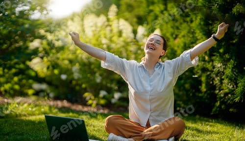 Preview: woman working on laptop in summer morning