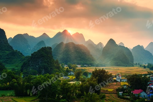 Preview: Sunset over Phong Nam Valley and local village in countryside at Vietnam