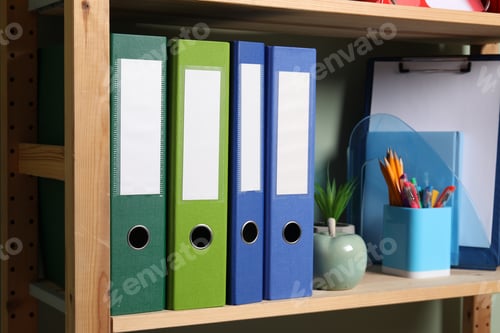 Preview: Colorful binder office folders and other stationery on shelving unit