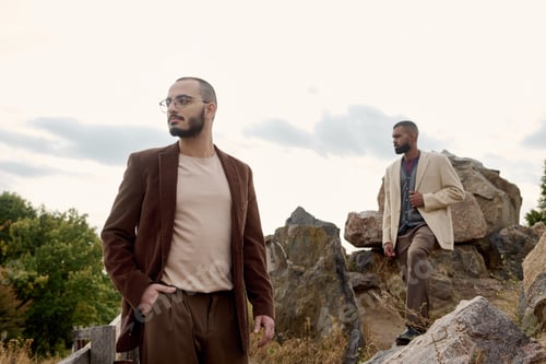 Preview: Male models display autumn fashion in a calm, colorful natural setting