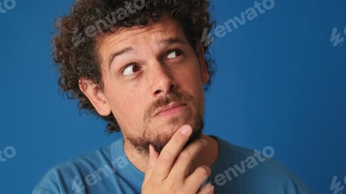 Preview: Close up, guy is thinking over difficult choice, imagining plan in his mind, having an idea