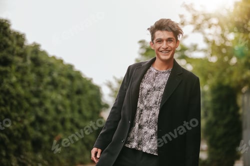 Preview: Handsome young man standing outdoors
