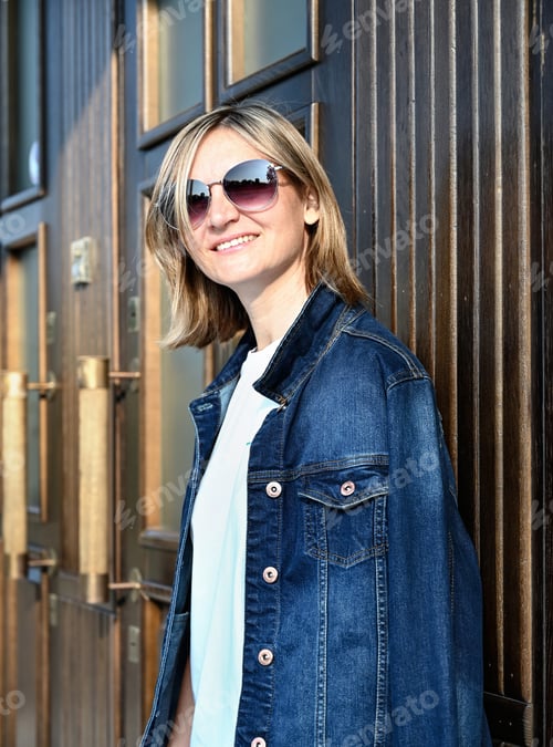 Preview: a confident young woman walks through the streets of the city, a woman smiles and enjoys life