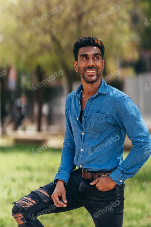 Preview: vertical portrait of young latin man smiling