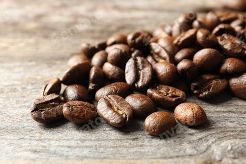 Preview: Roasted coffee beans on wooden background, closeup