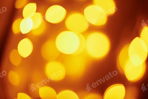 Preview: Background of golden lights in a bokeh. Defocused abstract blurred lights