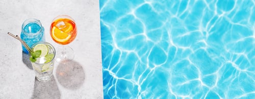 Preview: Refreshing cocktails by the pool on a sunny day
