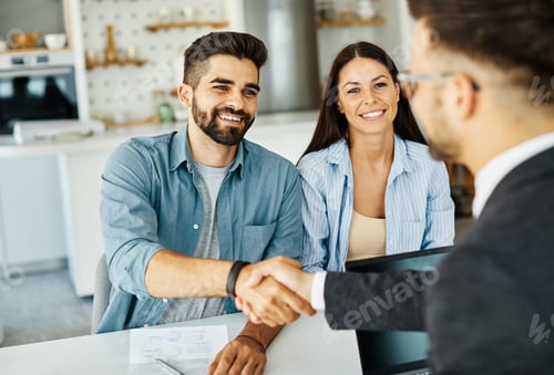 Preview: young couple shaking hands deal contract real estate investment business agreement agent